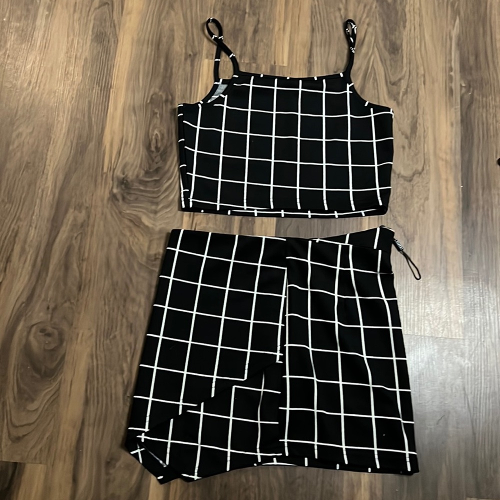 Black two piece with white stripes (skirt has a zipper in back)